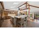 Gourmet kitchen featuring stainless steel appliances, a large island, and natural light with wood accents at 33448 Alta Vista Dr, Evergreen, CO 80439