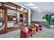 Comfortable sitting area with vaulted ceilings, skylights, and views into the living room at 33448 Alta Vista Dr, Evergreen, CO 80439