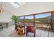 Relaxing sitting area with oversized windows offering breathtaking mountain views and natural light at 33448 Alta Vista Dr, Evergreen, CO 80439