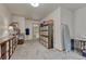 Large carpeted craft room features shelving units, an ironing board, and plenty of space for projects at 18470 Canterbury Dr, Monument, CO 80132