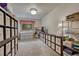 Spacious carpeted craft room featuring built-in shelving, large windows, and an abundance of natural light at 18470 Canterbury Dr, Monument, CO 80132