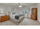 This bedroom features a metal bedframe, matching dressers, plush carpeting, and a window with patterned curtains at 18470 Canterbury Dr, Monument, CO 80132
