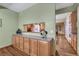 Kitchen with granite counters, light wood cabinets, and view to dining room at 18470 Canterbury Dr, Monument, CO 80132