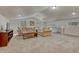 Upstairs living room with neutral tones, vaulted ceilings, and comfortable seating, perfect for relaxation and entertainment at 18470 Canterbury Dr, Monument, CO 80132