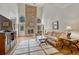 Living room featuring a striking stone fireplace, high ceilings, and cozy decor at 18470 Canterbury Dr, Monument, CO 80132