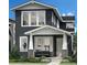 Charming two-story home with a covered porch and modern architectural details at 612 Apex St, Erie, CO 80516