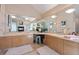 Bathroom featuring double sinks, a vanity, large mirrors, and modern fixtures and tile at 23 Hess Ave, Golden, CO 80401