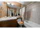 The bathroom features a vanity, toilet and shower-tub combination at 23 Hess Ave, Golden, CO 80401