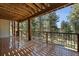 A spacious wooden deck offers stunning views of the surrounding forest at 23 Hess Ave, Golden, CO 80401