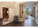 Spacious foyer with tile floors and a view into the living room with large windows and a stone fireplace at 23 Hess Ave, Golden, CO 80401