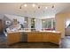 Well-designed kitchen featuring wood cabinets, granite countertops, and views into the living room at 23 Hess Ave, Golden, CO 80401