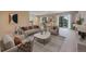 Spacious living room featuring modern decor, neutral colors, and large windows with tree views at 23 Hess Ave, Golden, CO 80401