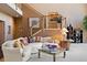 Comfortable living room showcasing a sectional sofa, modern staircase, and stylish decor at 23 Hess Ave, Golden, CO 80401