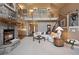 Spacious living room with stone fireplace, open floor plan, and staircase leading to upper level at 23 Hess Ave, Golden, CO 80401