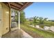 Backyard featuring an AC unit, a small pond and view of the home's siding at 3200 S Federal Blvd # 5, Denver, CO 80236