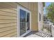 Cozy balcony with wood decking and white railing at 3200 S Federal Blvd # 5, Denver, CO 80236