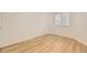 Cozy bedroom features neutral walls, light wood-look floors and a window with white blinds at 3200 S Federal Blvd # 5, Denver, CO 80236