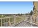 Spacious deck with white railing offering expansive views of the community at 3200 S Federal Blvd # 5, Denver, CO 80236