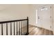 Bright entryway with wood-look flooring and modern front door with glass at 3200 S Federal Blvd # 5, Denver, CO 80236