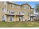 Exterior view of the home featuring multiple decks and sliding glass doors at 3200 S Federal Blvd # 5, Denver, CO 80236