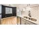 Bright kitchen with a stainless steel sink, updated appliances, and stylish backsplash at 3200 S Federal Blvd # 5, Denver, CO 80236