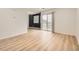 Spacious living room with a modern design, slider doors to balcony, and sleek flooring at 3200 S Federal Blvd # 5, Denver, CO 80236