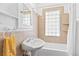 Charming bathroom with vintage-style pedestal sink and bathtub with tile surround at 525 N Pearl St, Denver, CO 80203