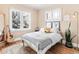 Bright bedroom featuring hardwood floors, lots of natural light, neutral walls, and stylish decor at 525 N Pearl St, Denver, CO 80203