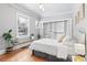 Bright and airy bedroom with hardwood floors, a walk-in closet, and lots of natural light at 525 N Pearl St, Denver, CO 80203