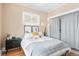 Comfortable bedroom with neutral paint, hardwood floors, large closets, and lots of natural light at 525 N Pearl St, Denver, CO 80203