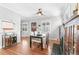 Inviting dining room featuring a decorative fireplace, hardwood floors, and abundant natural light at 525 N Pearl St, Denver, CO 80203