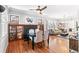 Charming dining room with hardwood floors, a fireplace, and built-in bookcases at 525 N Pearl St, Denver, CO 80203