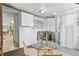 Convenient laundry room featuring high-efficiency machines and ample storage at 525 N Pearl St, Denver, CO 80203