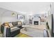 Spacious living room with a fireplace and built-in bookshelves, perfect for relaxing and entertaining at 525 N Pearl St, Denver, CO 80203