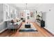 Bright living room with hardwood floors, gray sofa, and modern decor, bathed in natural light at 525 N Pearl St, Denver, CO 80203