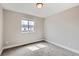 Cozy carpeted bedroom with a window, neutral paint, and ample space at 2653 W 69Th Dr, Denver, CO 80221