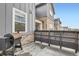Outdoor patio area with a grill and a wooden fence for privacy, next to the building at 2653 W 69Th Dr, Denver, CO 80221