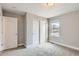Bedroom with carpet, closet, and a window offering neighborhood views at 2653 W 69Th Dr, Denver, CO 80221