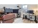 Well-lit bedroom with cat tree, work-from-home setup, and modern design at 2653 W 69Th Dr, Denver, CO 80221