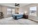 Light-filled main bedroom with a large window, plush carpeting, and ample space at 2653 W 69Th Dr, Denver, CO 80221
