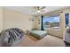 Inviting bedroom with a large window offering scenic views of the outdoors and a backyard at 14461 Inca Ct, Westminster, CO 80023