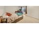 Bedroom featuring a comfortable bed, desk area, and a window with natural light at 14461 Inca Ct, Westminster, CO 80023