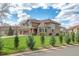 Stunning two-story home featuring lush green lawn and mature landscaping at 14461 Inca Ct, Westminster, CO 80023