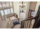 Open foyer with wooden floors, staircase and bright, neutral decor at 14461 Inca Ct, Westminster, CO 80023