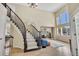 Open foyer with high ceilings, curved staircase, and lots of natural light at 14461 Inca Ct, Westminster, CO 80023