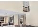 A view from the living room showcasing a staircase and the connection to the kitchen area at 14461 Inca Ct, Westminster, CO 80023