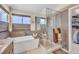 Contemporary main bathroom featuring a soaking tub and a separate glass-enclosed shower at 14461 Inca Ct, Westminster, CO 80023