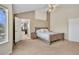 Comfortable main bedroom with neutral colors, lots of natural light, and an ensuite bathroom at 14461 Inca Ct, Westminster, CO 80023