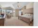 Spacious main bedroom with a ceiling fan, a large window and ensuite bathroom at 14461 Inca Ct, Westminster, CO 80023