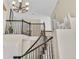 Elegant staircase with dark metal railing and bright, neutral decor at 14461 Inca Ct, Westminster, CO 80023